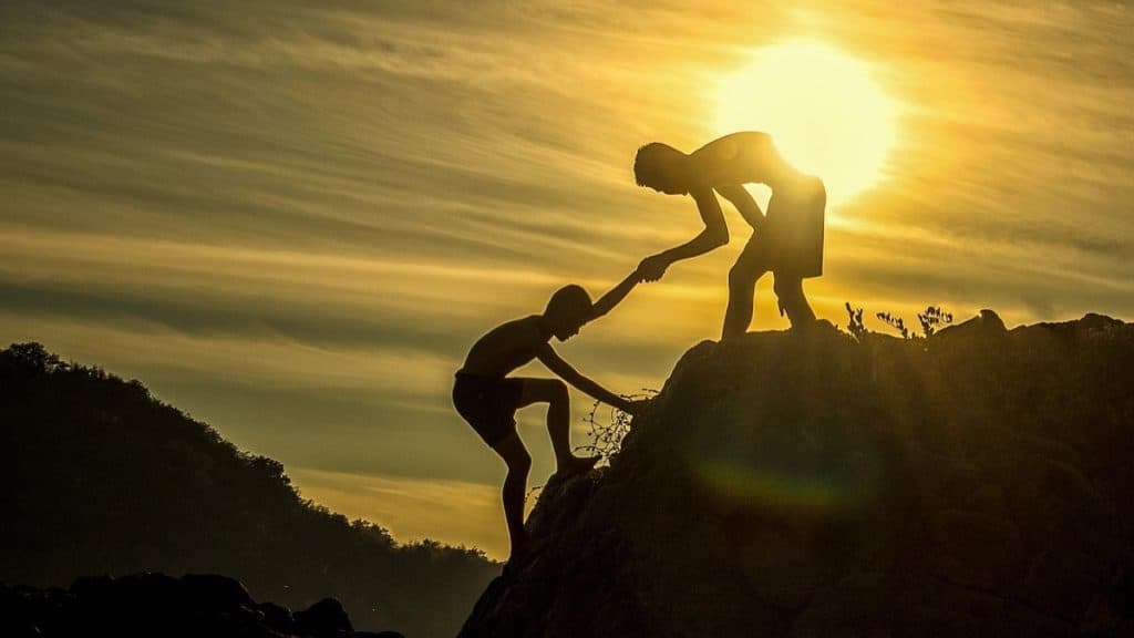 get employees to take ownership helping hand climbing hill 1024x576 1