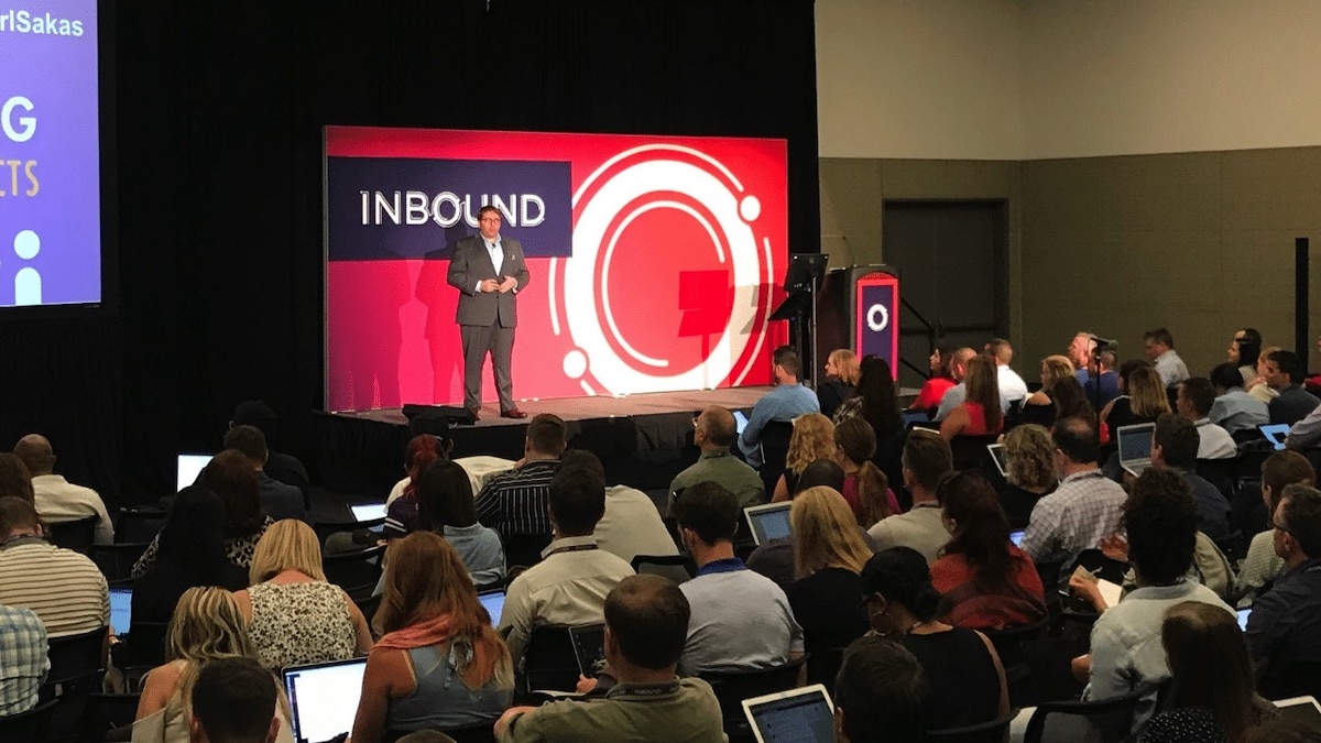 Karl Sakas speaking about agency growth on stage at HubSpot
