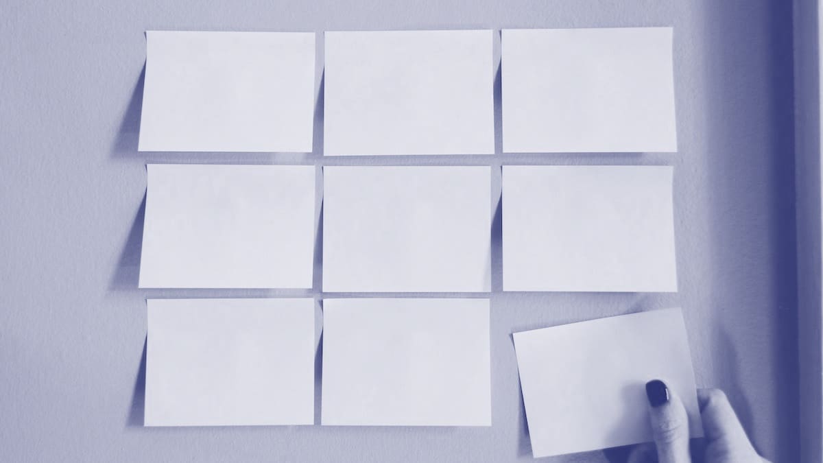 Sticky notes on wall symbolizing the Values, Goals, and Resources (VGR) framework for building a self-sufficient team